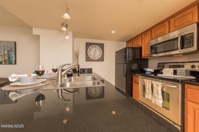 450 N Arlington Ave Unit 715, Reno, NV 89503 - kitchen featuring appliances with stainless steel finishes and brown cabinets
