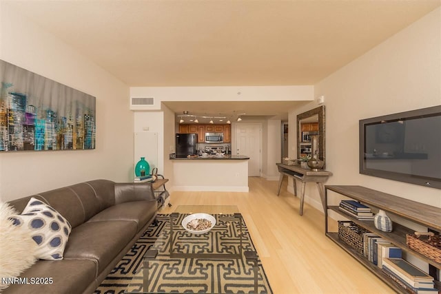 450 N Arlington Ave Unit 715, Reno, NV 89503 - living area with light wood-style floors