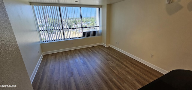 450 N Arlington Ave Unit 715, Reno, NV 89503 - empty room with dark wood finished floors and baseboards