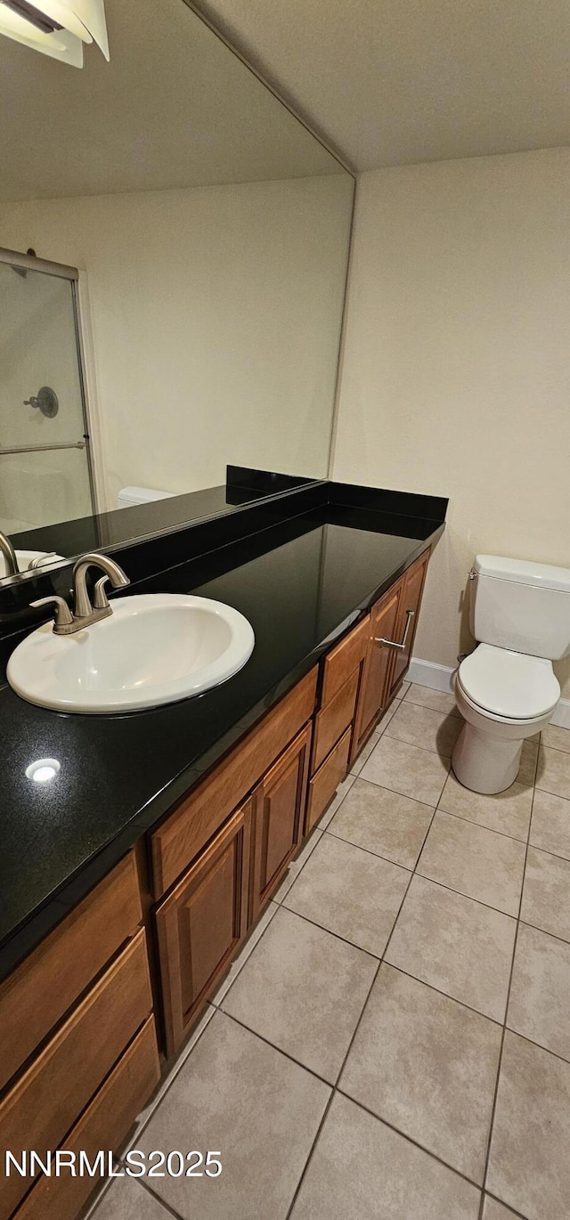 450 N Arlington Ave Unit 715, Reno, NV 89503 - bathroom featuring tile patterned flooring, vanity, and a shower