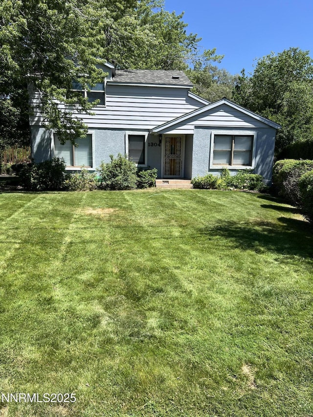 1304 Clough Rd, Reno, NV 89509 - view of front of property with a front lawn and stucco siding