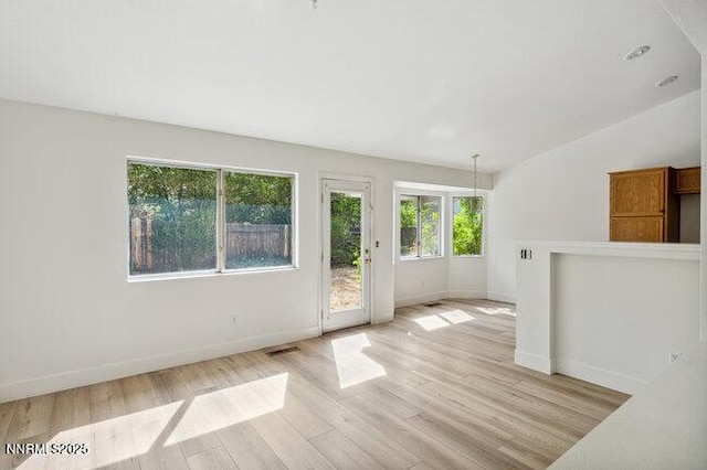 8589 Turtle Creek Ct, Reno, NV 89506 - spare room featuring vaulted ceiling and light wood finished floors