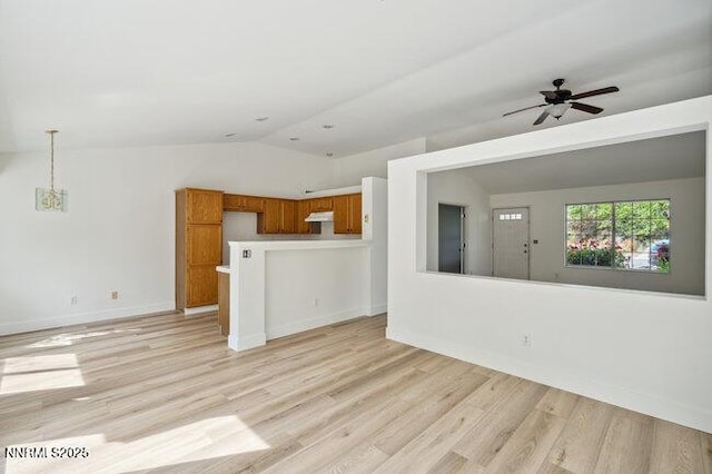 8589 Turtle Creek Ct, Reno, NV 89506 - unfurnished living room with lofted ceiling, light wood-style flooring, and a ceiling fan