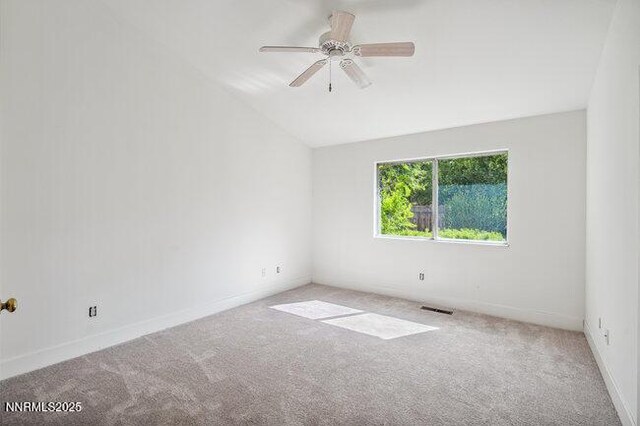 8589 Turtle Creek Ct, Reno, NV 89506 - spare room featuring carpet floors, ceiling fan, and vaulted ceiling