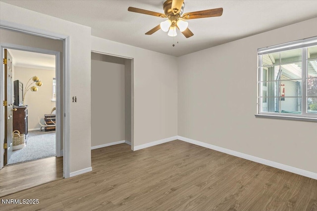 1510 E Slide Mountain Dr, Carson City, NV 89706 - unfurnished bedroom with wood finished floors and a ceiling fan