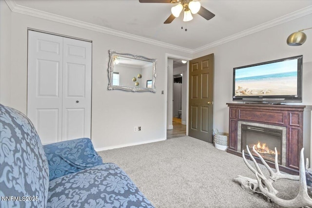 1510 E Slide Mountain Dr, Carson City, NV 89706 - sitting room featuring a ceiling fan, ornamental molding, carpet floors, a lit fireplace, and healthy amount of natural light