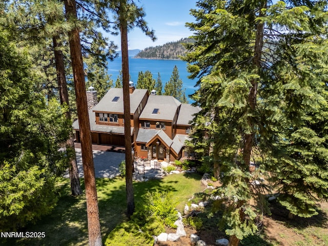 187 Yellow Jacket Rd, Glenbrook, NV 89413 - back of property with a water view, a chimney, and a lawn