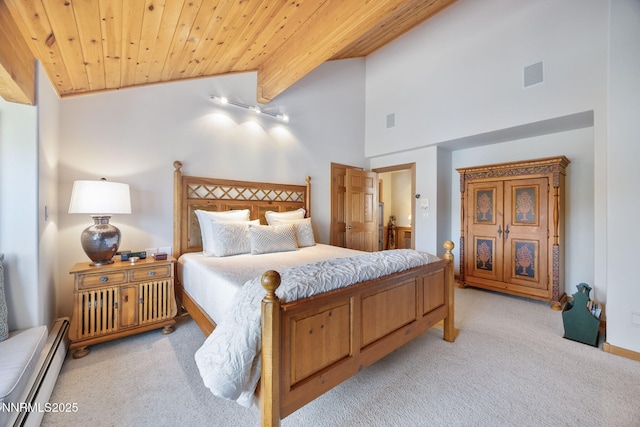 187 Yellow Jacket Rd, Glenbrook, NV 89413 - bedroom with baseboard heating, light carpet, wood ceiling, and high vaulted ceiling