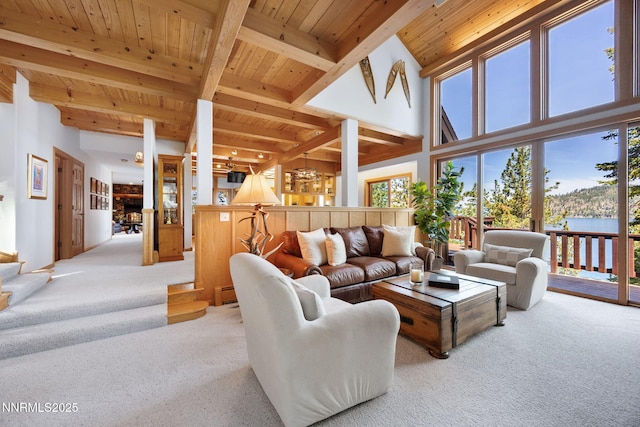 187 Yellow Jacket Rd, Glenbrook, NV 89413 - living area with light carpet, a wood ceiling with exposed beams, a chandelier, and a towering ceiling