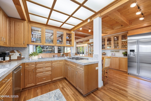 187 Yellow Jacket Rd, Glenbrook, NV 89413 - kitchen featuring stainless steel appliances, rail lighting, light wood-type flooring, a wood ceiling with exposed beams, and a peninsula