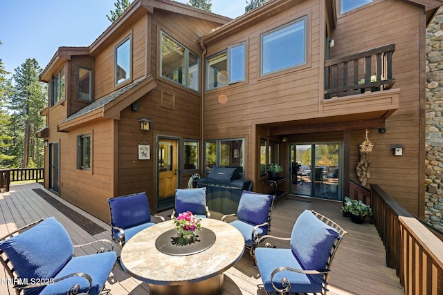 187 Yellow Jacket Rd, Glenbrook, NV 89413 - rear view of house featuring a deck and outdoor dining space