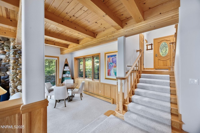 187 Yellow Jacket Rd, Glenbrook, NV 89413 - carpeted dining room with a baseboard radiator, a wooden ceiling with exposed beams, a wainscoted wall, and stairway