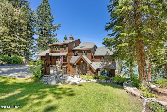 187 Yellow Jacket Rd, Glenbrook, NV 89413 - view of front of house with a chimney, a front yard, and driveway