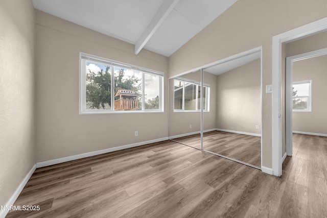 12102 Rocky Mountain St, Reno, NV 89506 - unfurnished bedroom featuring multiple windows, wood finished floors, and a closet