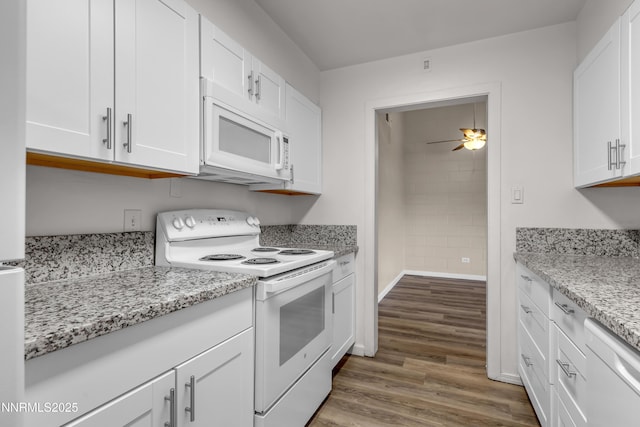 12102 Rocky Mountain St, Reno, NV 89506 - kitchen with white appliances, white cabinets, wood finished floors, a ceiling fan, and light stone countertops