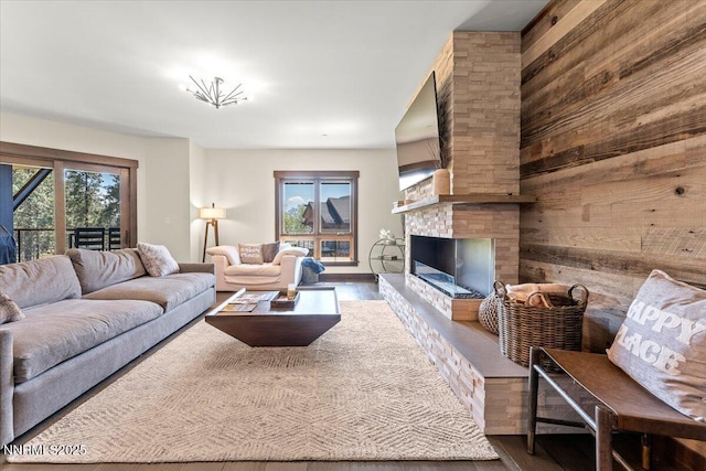 17 Beach Club Dr # 213, Stateline, NV 89449 - living room featuring wood finished floors, wooden walls, and a brick fireplace