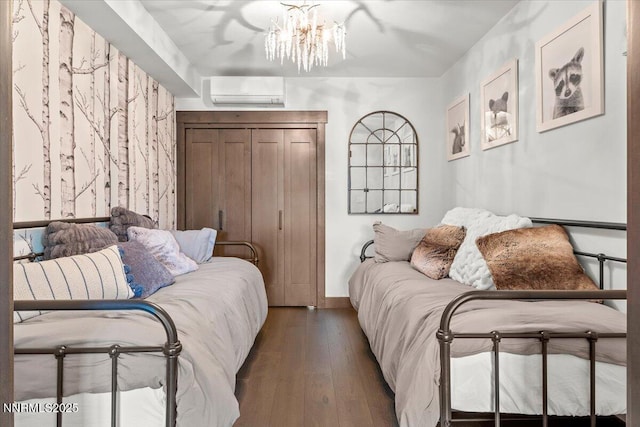 17 Beach Club Dr # 213, Stateline, NV 89449 - bedroom with a wall mounted AC, hardwood / wood-style flooring, and a chandelier