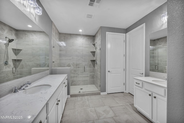 1975 Phaethon Ln, Reno, NV 89521 - bathroom with a shower stall, two vanities, and recessed lighting