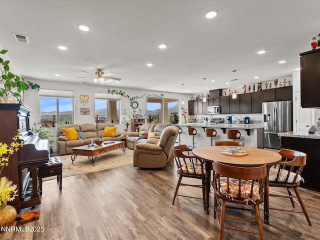 2217 Millville Dr, Spanish Springs, NV 89441 - dining space with recessed lighting, healthy amount of natural light, wood finished floors, and ceiling fan
