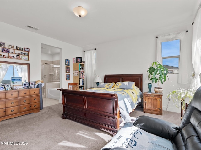 2217 Millville Dr, Spanish Springs, NV 89441 - bedroom with light carpet, multiple windows, and ensuite bath
