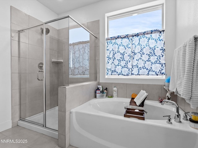 2217 Millville Dr, Spanish Springs, NV 89441 - bathroom featuring a shower stall, a garden tub, and tile patterned flooring