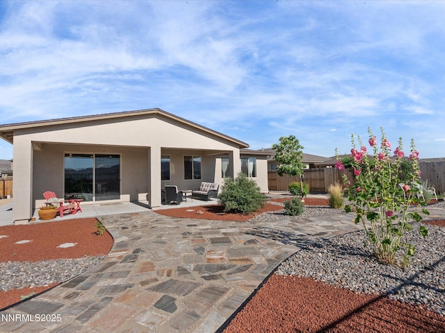 2217 Millville Dr, Spanish Springs, NV 89441 - back of property featuring stucco siding and a patio