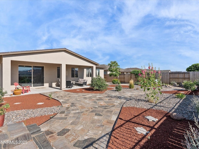 2217 Millville Dr, Spanish Springs, NV 89441 - rear view of property featuring a patio, a fenced backyard, and stucco siding