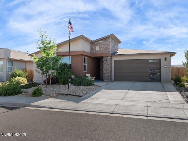 2217 Millville Dr, Spanish Springs, NV 89441 - view of front facade featuring a garage, concrete driveway, and stucco siding