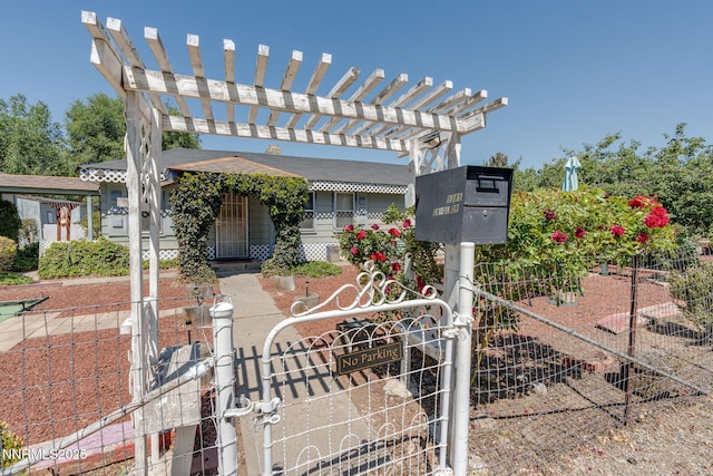 5385 Carol Dr, Sun Valley, NV 89433 - view of front of home with a fenced front yard, a gate, and a pergola