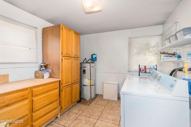 5385 Carol Dr, Sun Valley, NV 89433 - washroom featuring water heater, cabinet space, a textured ceiling, a wainscoted wall, and washer and dryer