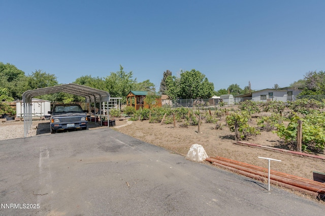 5385 Carol Dr, Sun Valley, NV 89433 - view of parking / parking lot featuring a detached carport