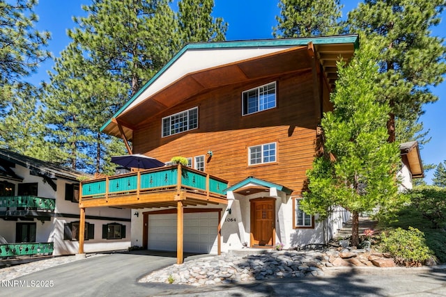 1064 Lucerne Way, Incline Village, NV 89451 - view of front of home with an attached garage, driveway, and stucco siding