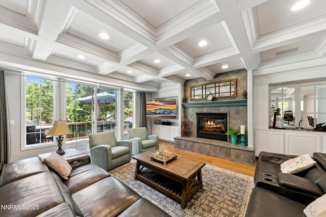 1064 Lucerne Way, Incline Village, NV 89451 - living area with coffered ceiling, a tile fireplace, wood finished floors, ornamental molding, and beamed ceiling