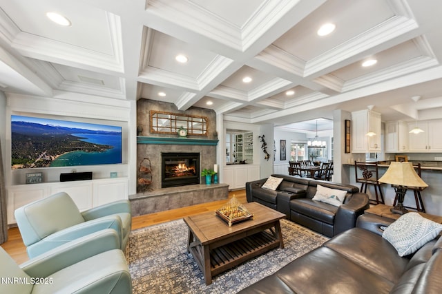 1064 Lucerne Way, Incline Village, NV 89451 - living area featuring crown molding, coffered ceiling, wood finished floors, a tiled fireplace, and beam ceiling