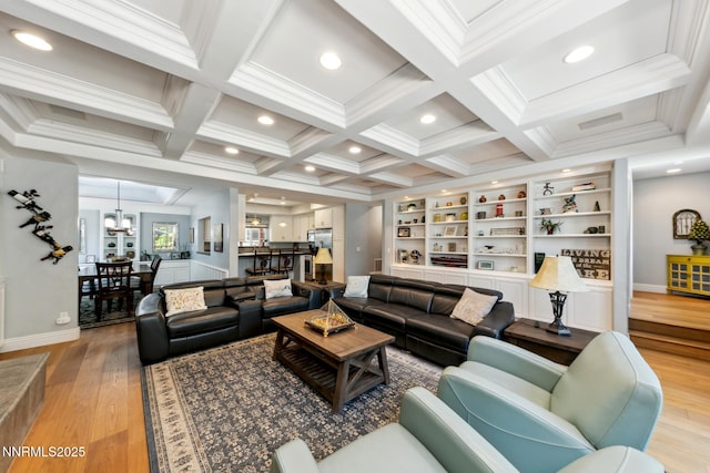 1064 Lucerne Way, Incline Village, NV 89451 - living room featuring light wood-style flooring, coffered ceiling, crown molding, beamed ceiling, and a chandelier