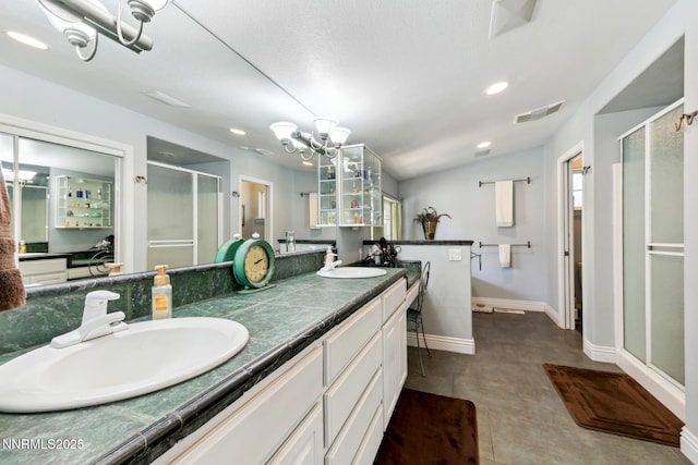 1064 Lucerne Way, Incline Village, NV 89451 - full bath featuring a shower stall, double vanity, a chandelier, and recessed lighting