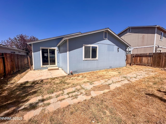 7420 Findhorn Dr, Reno, NV 89506 - back of property featuring a fenced backyard and a patio