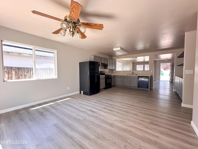 7420 Findhorn Dr, Reno, NV 89506 - kitchen featuring black appliances, gray cabinets, light wood-type flooring, a ceiling fan, and light countertops