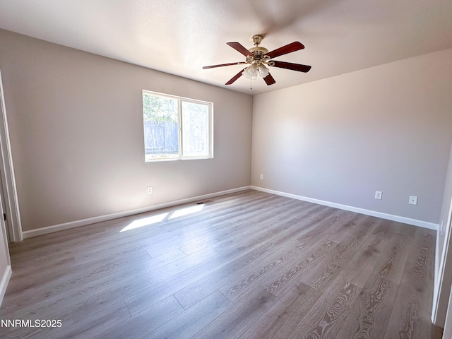 7420 Findhorn Dr, Reno, NV 89506 - empty room with wood finished floors and ceiling fan