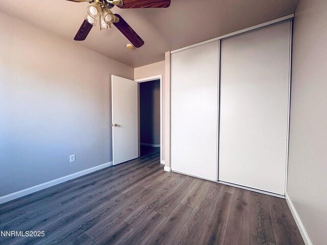7420 Findhorn Dr, Reno, NV 89506 - unfurnished bedroom with wood finished floors, a closet, and a ceiling fan