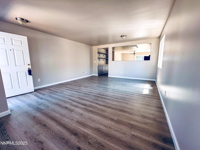 7420 Findhorn Dr, Reno, NV 89506 - unfurnished living room featuring dark wood-type flooring