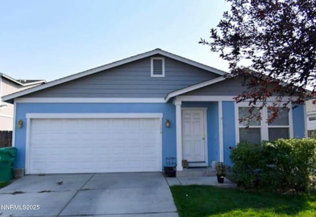 7420 Findhorn Dr, Reno, NV 89506 - view of front facade with driveway, an attached garage, and stucco siding