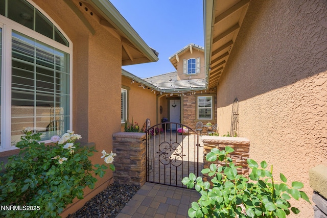 2021 Neviekay Ln, Reno, NV 89521 - doorway to property featuring stucco siding and a gate