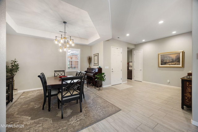 2021 Neviekay Ln, Reno, NV 89521 - dining area featuring wood finished floors, recessed lighting, a tray ceiling, and a chandelier