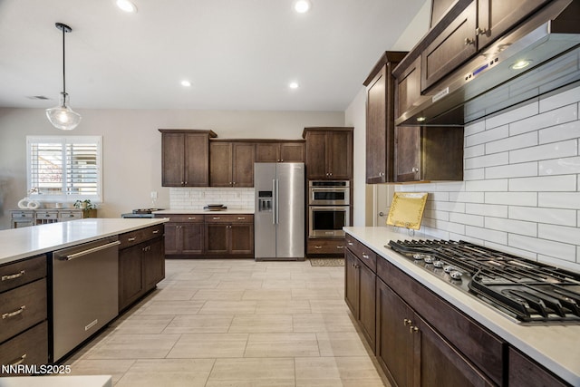 2021 Neviekay Ln, Reno, NV 89521 - kitchen with appliances with stainless steel finishes, extractor fan, light countertops, dark brown cabinetry, and recessed lighting