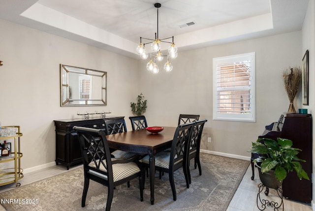 2021 Neviekay Ln, Reno, NV 89521 - dining room featuring a raised ceiling and a chandelier
