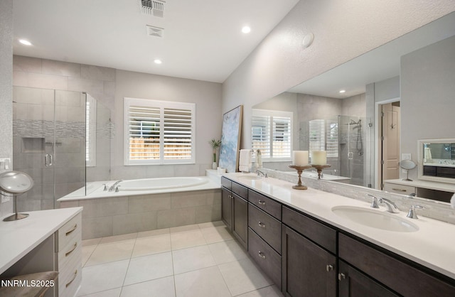 2021 Neviekay Ln, Reno, NV 89521 - full bathroom featuring a garden tub, double vanity, a shower stall, tile patterned flooring, and recessed lighting