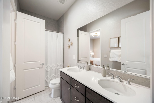2021 Neviekay Ln, Reno, NV 89521 - ensuite bathroom featuring double vanity, tile patterned flooring, and a shower with curtain
