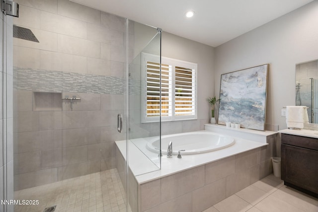 2021 Neviekay Ln, Reno, NV 89521 - bathroom featuring vanity, a shower stall, a bath, tile patterned flooring, and recessed lighting