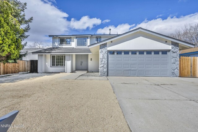4565 Rio Encantado Ln, Reno, NV 89502 - traditional-style home with stone siding, driveway, and an attached garage